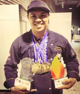 Kenneth Cacho of Batch 1990 proudly shows his trophies and medals during the 2015 Philippine Culinary Cup