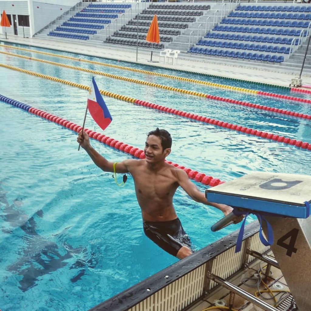 Sacho Ilustre waves the Philippine flag after finishing his event.