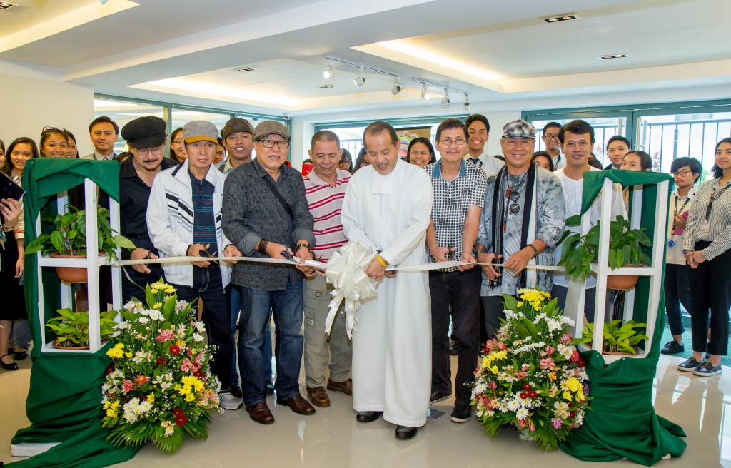 Br. Bernie (center) leads the ribbon cutting with artists from Angono Atelier Association.